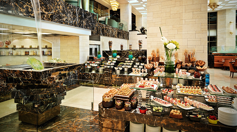 jumeirah messilah beach hotel spa garden cafe spread